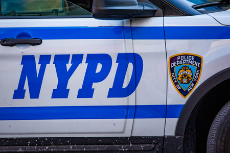 New York NYPD Police car with sirens at dayの写真素材