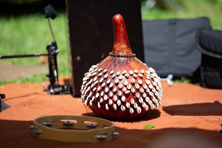 SHekere authentic african instrument outdoor shaker at day unique