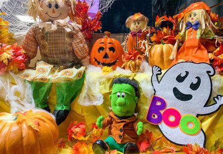 Halloween screen decorations with dolls and pumpkins fall harvest setupの写真素材