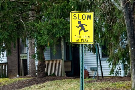 Children at play warning road sign outdoorsの写真素材