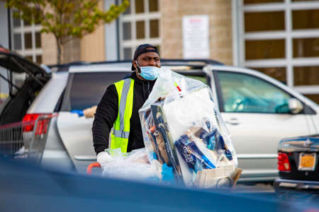 Princeton, NJ / USA - 04/16/2020 - People shopping at Costco wearing protective masks during...