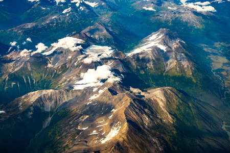 Aerial view of Alaska ice mountains covered with snowの写真素材