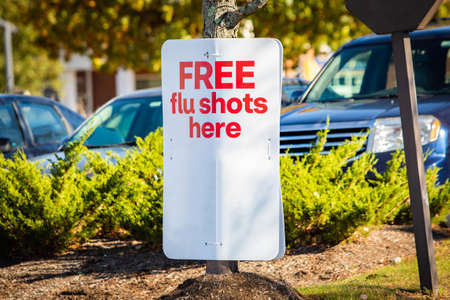 Free flue shots outdoor sign walk-in immunization providedの写真素材