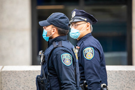 NY, NY, USA - Jan. 22, 2021: Postal service inspection police offcers wearing masks on the streetのeditorial素材
