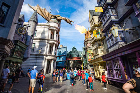 Orlando, USA - Feb. 12, 2021: Fire breathing dragon on top of Gringotts bank at Harry Potter Worldのeditorial素材