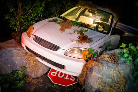 Crashed car at night after road accident