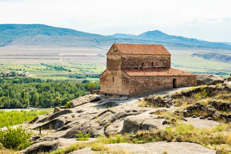 Ancient church monastery in caves city build in rocks in Uplistsikhe Georgia at daylight