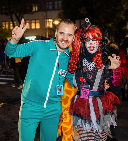 New York, NY - October 31, 2021: Scary clowns and witches costumes at NYC Village Halloween paradeのeditorial素材