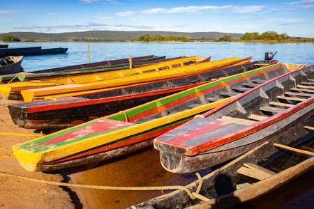 Set of colorful wooden boats on the river shore tourist attraction tourの写真素材