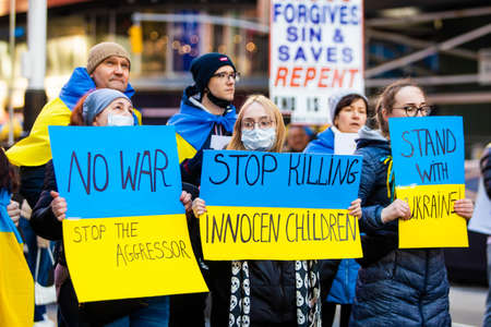New York, NY - 02-27-2022: Civil protests agains Russian war in Ukraine at Times Square