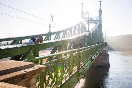 Budapest, Hungary - December 21, 2022: Szchenyi chain bridge on sunny day across Danube river