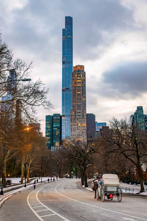 Vintage winter view on Manhattan cityscape buildings from Central Park with horse carriage attraction in New Yorkの写真素材