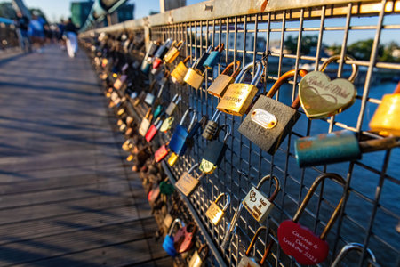 Krakow, Poland - 09-06-2023: Father Bernateks Bridge covered with many locks at sunny day in Krakov Polandのeditorial素材