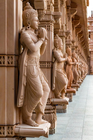 Scenic hindu statues decorating Akshardham Mahamandir temple at BAPS Swaminarayan Akshardham close...