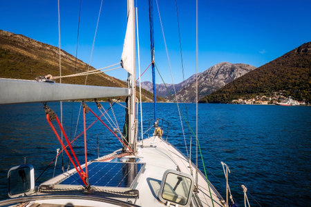 Sailing in yacht through the mediterranean sea at sunny dayの写真素材