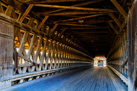 Photo of the Bavarian Inn Covered Bridge in Frankenmuth Michigan taken during the day showing its classic wooden design and Bavarian architecture.の写真素材