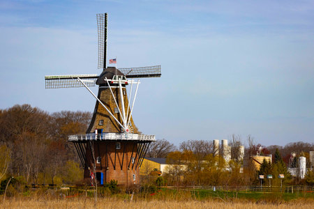 Photo of authentic full size Dutch windmill at Windmill Island Gardens in Holland Michigan surrounded by gardens and classic heritage.の写真素材