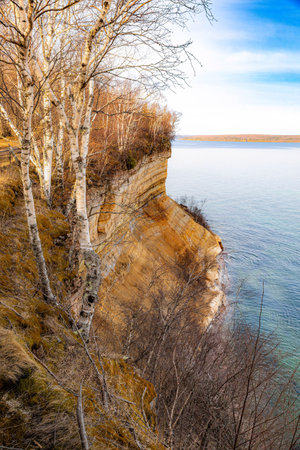 Photo of Miners Castle Rock at Pictured Rocks National Lakeshore Michigan during sunset with golden light over cliffs and Lake Superior.の写真素材