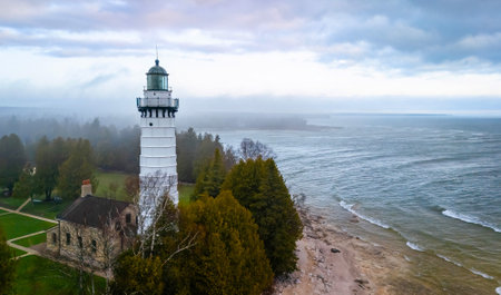 Dramatic aerial image of Cana Island Lighthouse in Wisconsin captured on a foggy day along Lake Michigan shorelineの写真素材