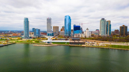 Milwaukee Wisconsin city skyline with modern skyscrapers captured from Lakeshore State Park along Lake Michigan waterfront.の写真素材