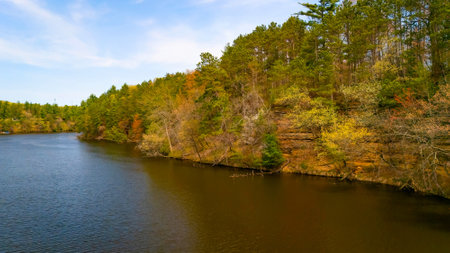 View of Mirror Lake State Park in Wisconsin capturing Echo Rock scenic sandstone cliffs and calm lake reflection from the water.の写真素材