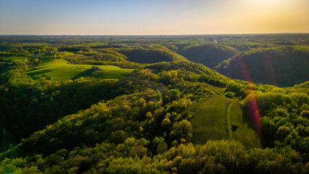 Aerial view from Apple Blossom Overlook Park showing rolling green hills and farmland at sunset with golden light over the rural Wisconsin landscape.の写真素材