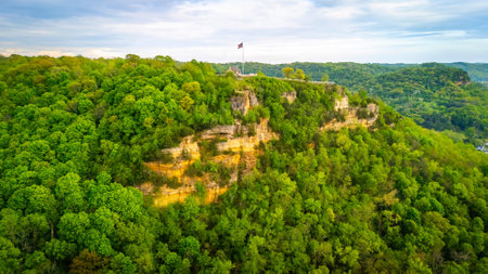 Grandad Bluff at sunset overlooking La Crosse Wisconsin with glowing sky, city view, and scenic sandstone cliff formation.の写真素材