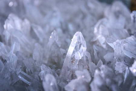 Detailed closeup view of white quartz crystals showing natural texture, sharp facets, and...