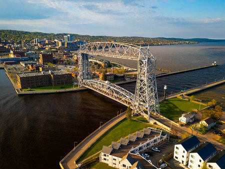 Breathtaking aerial scene showcasing the Duluth Lift Bridge and surrounding lighthouses