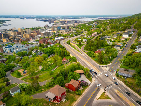 Stunning aerial view of Duluth showcasing city buildings and the scenic shoreline of Lake Superior in Minnesotaの写真素材