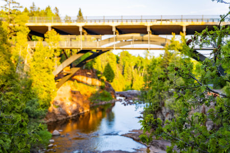 Beautiful sunset view of the Gooseberry River Bridge at Gooseberry Falls State Parkの写真素材