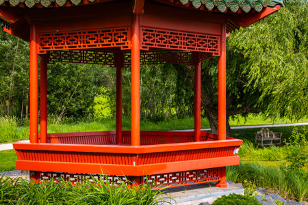Beautiful chinese garden with red Gazebo on sunny day at Minnesota Landscape Arboretumの写真素材