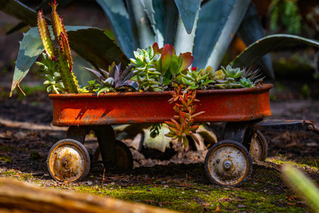 A beautiful urn planter vase overflowing with vibrant flowers at Munsinger Gardensの写真素材