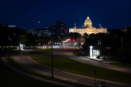 A scenic view of the majestic Minnesota State Capitol building in St. Paul, dramatically illuminated against the night skyの写真素材