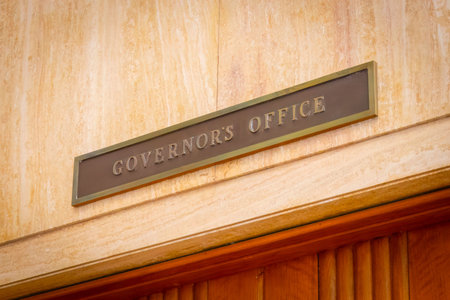 A formal and official sign on the door of the Governors office
