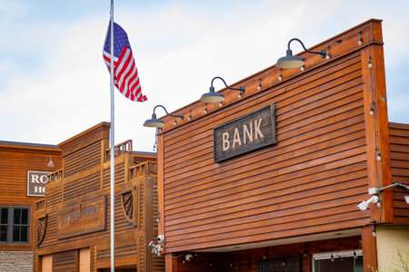 A picturesque view of Medora historic town street with the dramatic and rugged Badlands mountainsの写真素材