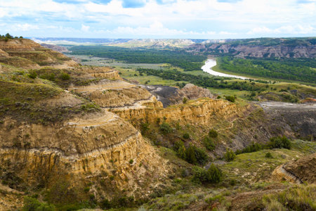 A sweeping panoramic view from the River Bend Overlook Trail in Theodore Roosevelt National Park captures the majestic Missouri vistaの写真素材