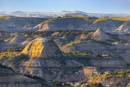 Scenic vibrant view of Roosevelt National Park colorful Canyons under sunset sunの写真素材