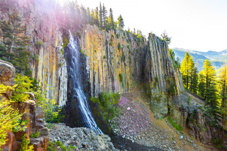 A beautiful view captures the majestic Palisade Falls at sunrise within the Custer Gallatin National...