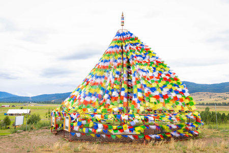 Colorful ornament mantra flags add a vibrant and spiritual element to the serene landscape of the Garden of 1000 Buddhasの写真素材