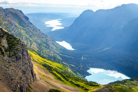 A breathtaking view captures Grinnell Glacier and Upper Grinnell Lake from a scenic overlook in...