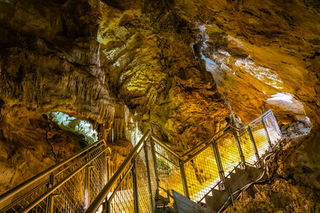 A scenic and illuminated view of the caverns inside Lewis and Clark Caverns State Park is captured, highlighting the stunning geological formations and the unique lighting that enhances their beautyの写真素材