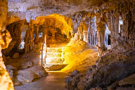A scenic and illuminated view of the caverns inside Lewis and Clark Caverns State Park is captured, highlighting the stunning geological formations and the unique lighting that enhances their beautyの写真素材
