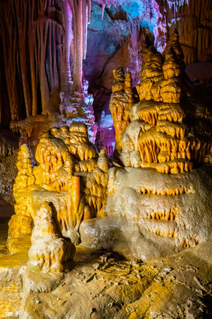 A scenic and illuminated view of the caverns inside Lewis and Clark Caverns State Park is captured, highlighting the stunning geological formations and the unique lighting that enhances their beautyの写真素材