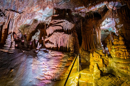 A scenic and illuminated view of the caverns inside Lewis and Clark Caverns State Park is captured, highlighting the stunning geological formations and the unique lighting that enhances their beautyの写真素材