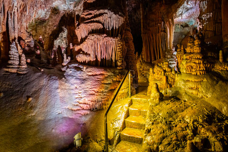 A scenic and illuminated view of the caverns inside Lewis and Clark Caverns State Park is captured, highlighting the stunning geological formations and the unique lighting that enhances their beautyの写真素材