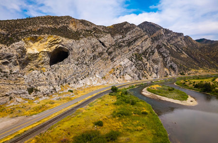 An aerial view of the Jefferson River and the Lewis and Clark Caverns State Park is captured, showcasing the confluence of the natural waterway and the iconic park from an elevated perspectiveの写真素材