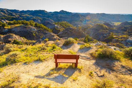 A dramatic sunset over the badlands formations of Makoshika State Park as seen from the Cap Rock Trailの写真素材