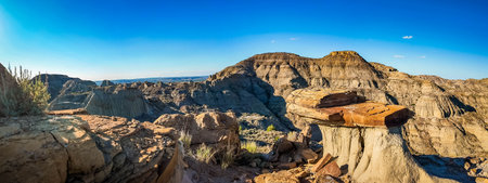 A dramatic sunset over the badlands formations of Makoshika State Park as seen from the Cap Rock...