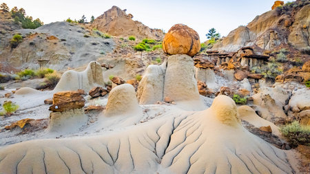 Beautiful formations of rocks and sandstone at dusk on the Kinney Coulee trail
